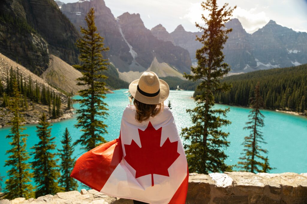A University Student with the Canadian Flag wrapped around her