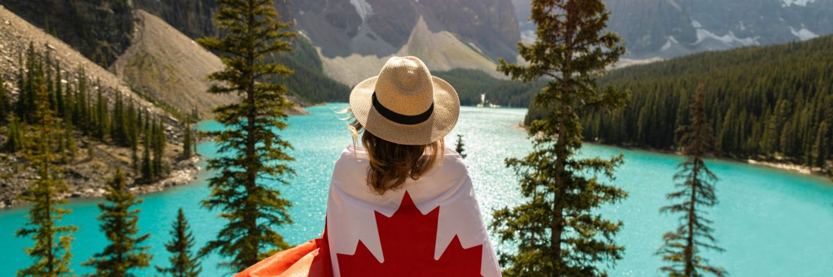 From Application to Arrival Your Ultimate 9–12 Month Timeline for Studying Abroad in Canada A University Student with the Canadian Flag wrapped around her